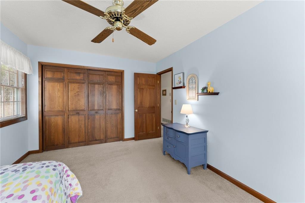 3585 Ridgewood Point Gainesville, GA 30504 - Photo 26 of 41 a bedroom with a bed and ceiling fan