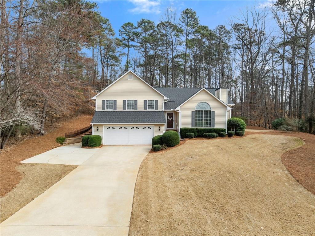 3585 Ridgewood Point Gainesville, GA 30504 - Photo 40 of 41 a front view of a house with a yard and garage