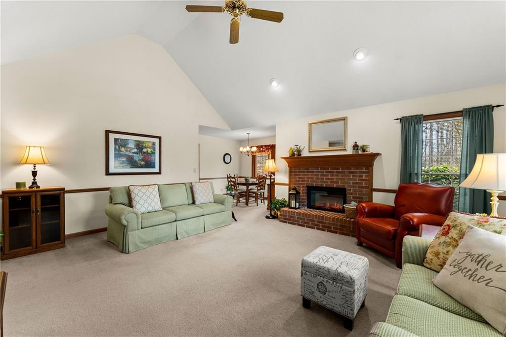 3585 Ridgewood Point Gainesville, GA 30504 - Photo 6 of 41 a living room with furniture and a fireplace