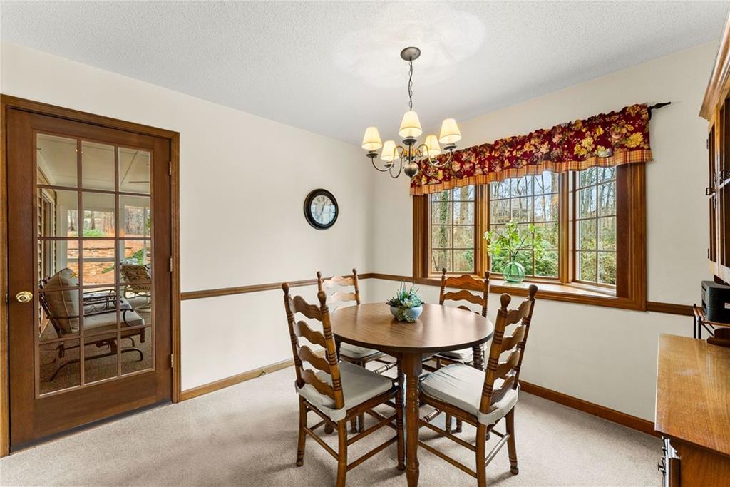 3585 Ridgewood Point Gainesville, GA 30504 - Photo 8 of 41 a dining room with furniture a chandelier and window
