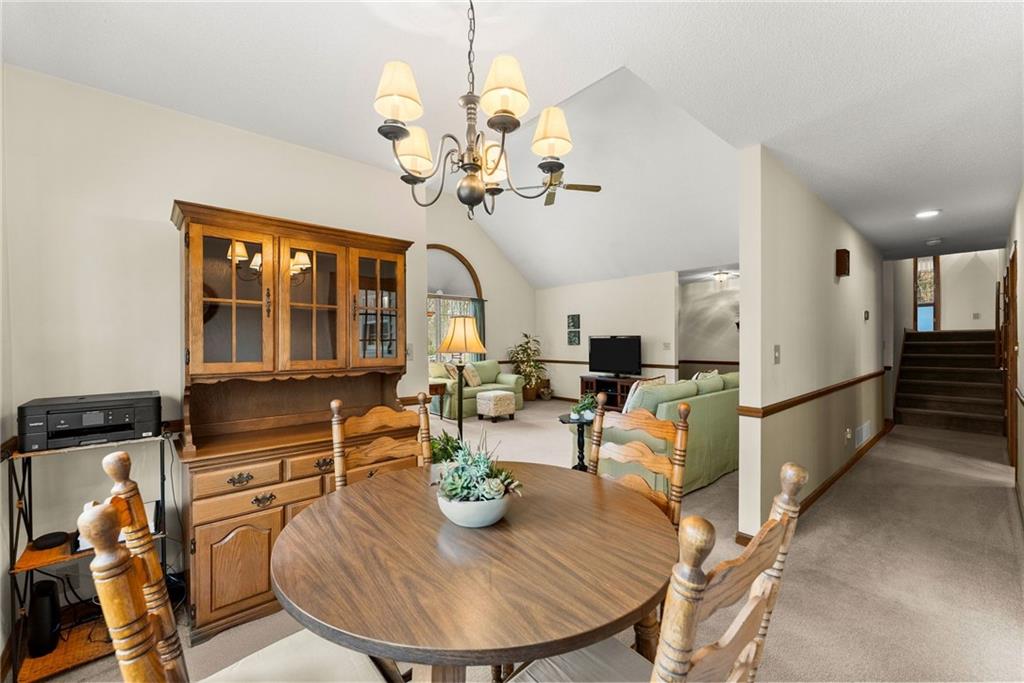 3585 Ridgewood Point Gainesville, GA 30504 - Photo 9 of 41 a view of a dining room with furniture a chandelier and wooden floor