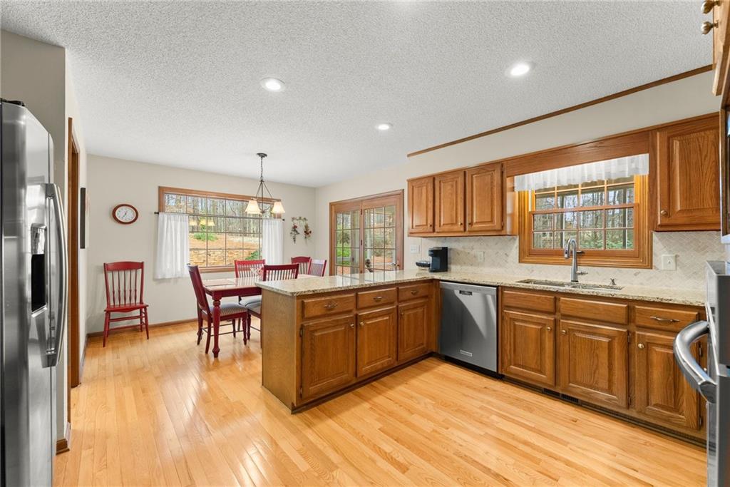 3585 Ridgewood Point Gainesville, GA 30504 - Photo 10 of 41 a kitchen with a sink stove and cabinets