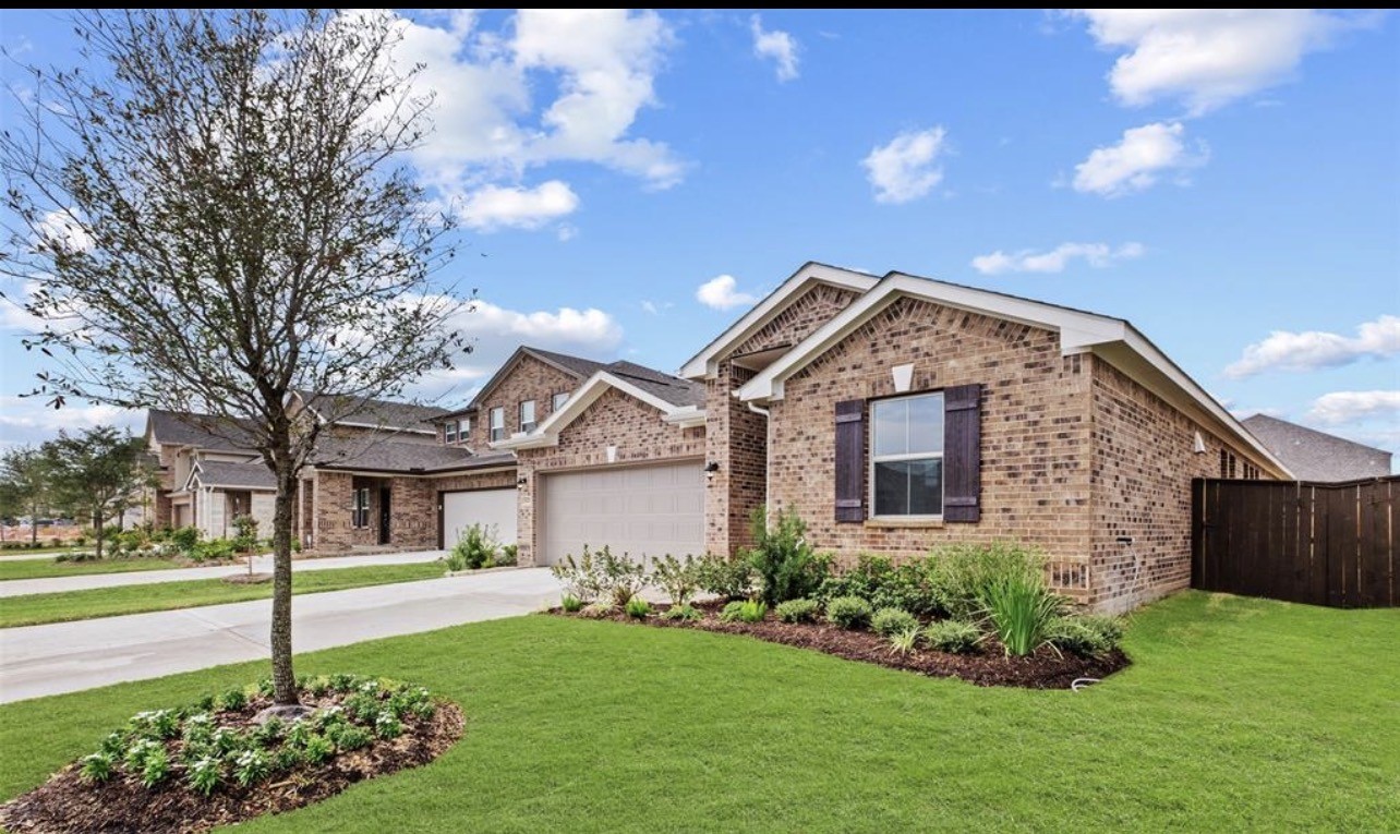 4327 Reese Ravine Lane Katy, TX 77493 - Photo 1 of 34 a front view of a house with garden