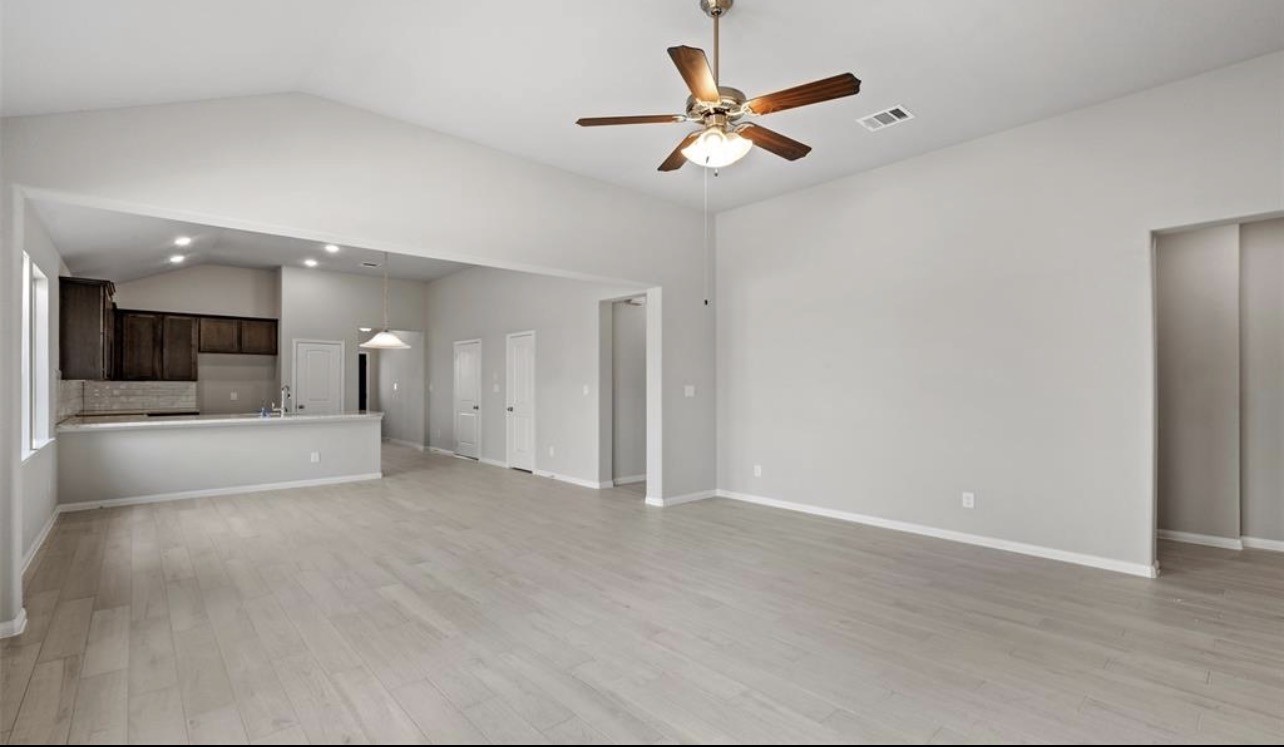 4327 Reese Ravine Lane Katy, TX 77493 - Photo 16 of 34 an empty room with a view of a kitchen