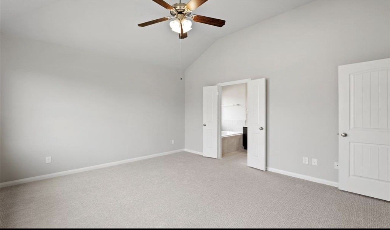 4327 Reese Ravine Lane Katy, TX 77493 - Photo 19 of 34 an empty room with a ceiling fan and a window
