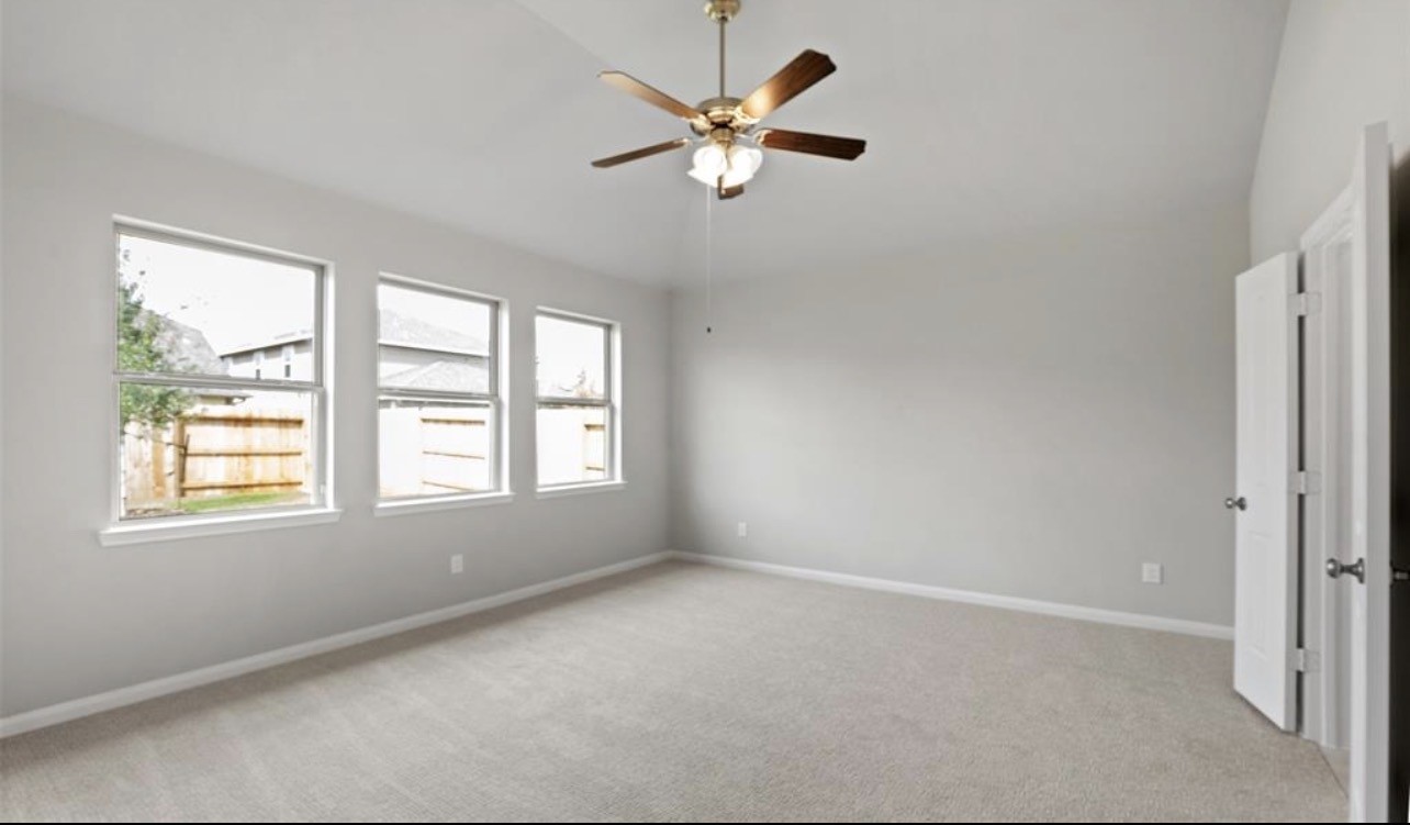 4327 Reese Ravine Lane Katy, TX 77493 - Photo 21 of 34 an empty room with window and ceiling fan