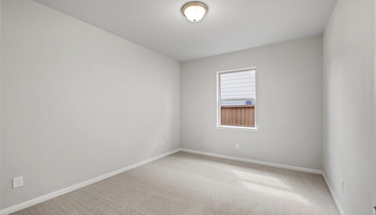 4327 Reese Ravine Lane Katy, TX 77493 - Photo 27 of 34 an empty room with a window