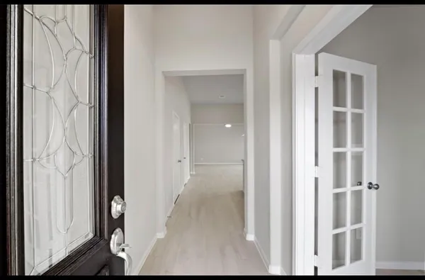 a view of a bedroom from entryway