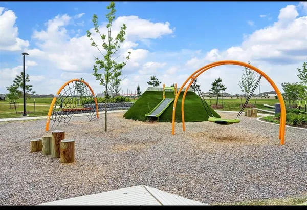 a view of a lake with a garden in the background