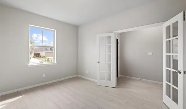 a view of an empty room with a window