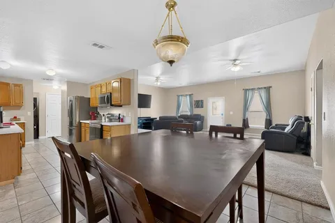 a kitchen with stainless steel appliances granite countertop a sink and cabinets