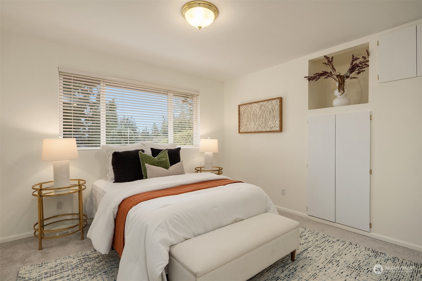 405 240th Street Southwest Bothell, WA 98021 - Photo 16 of 37 a bedroom with a bed and a lamp