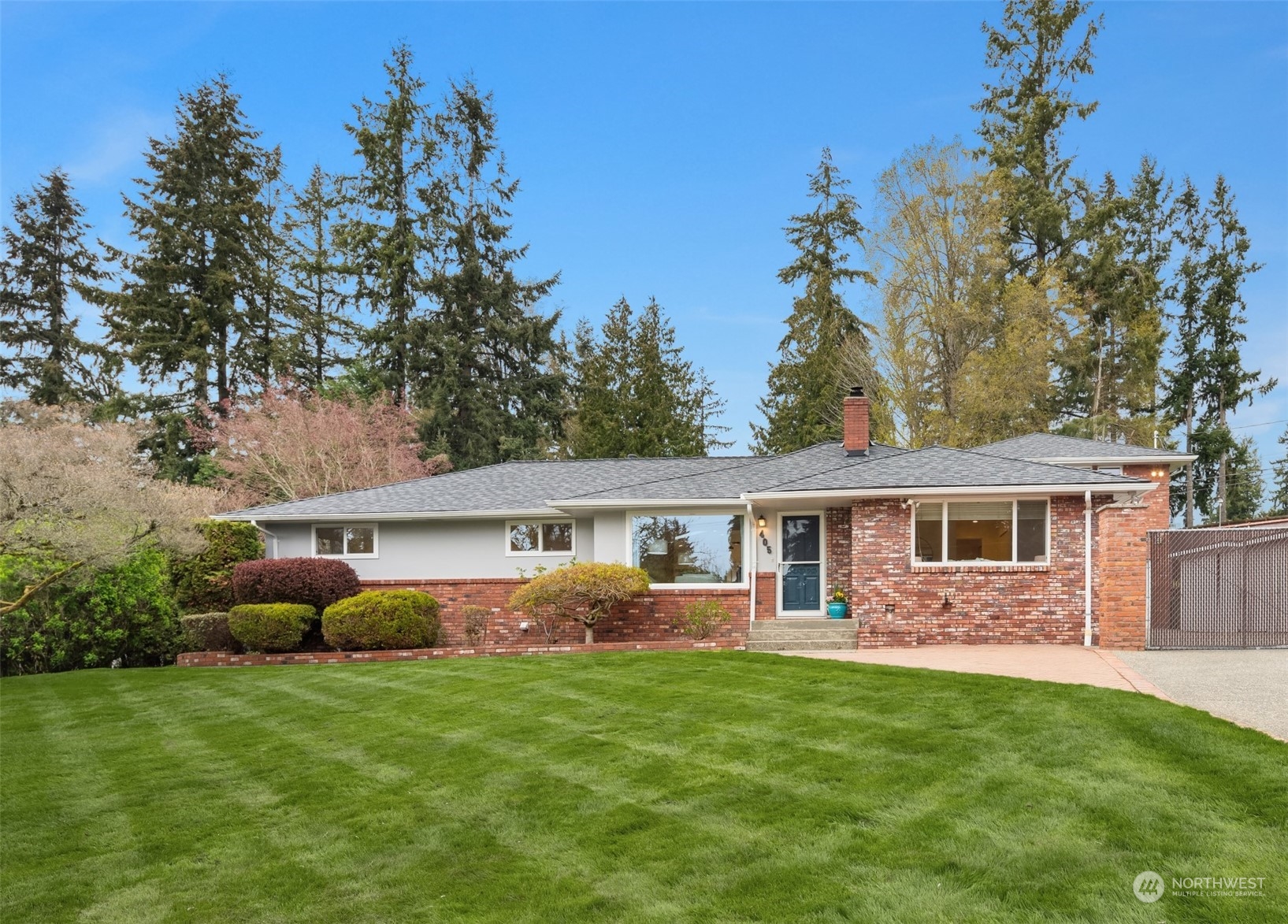 405 240th Street Southwest Bothell, WA 98021 - Photo 2 of 37 a front view of house with yard and green space
