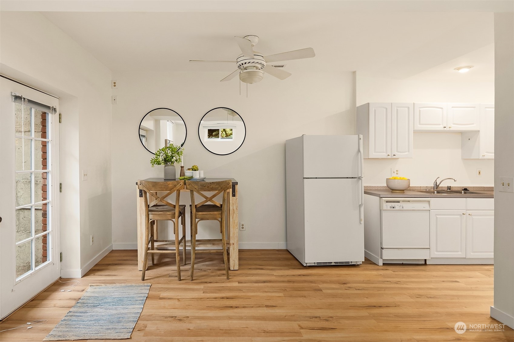 405 240th Street Southwest Bothell, WA 98021 - Photo 24 of 37 a view of a kitchen with cabinets and wooden floor