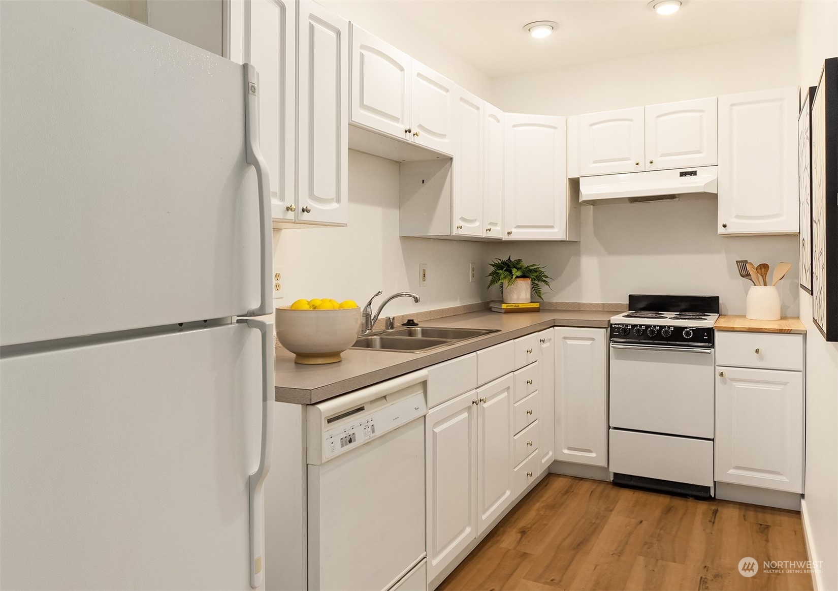 405 240th Street Southwest Bothell, WA 98021 - Photo 25 of 37 a kitchen with white cabinets and white appliances