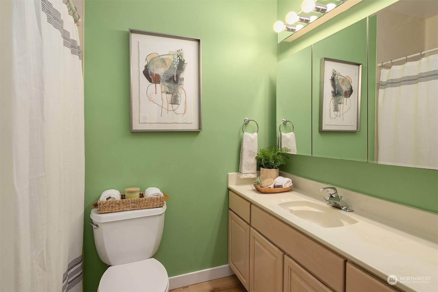 405 240th Street Southwest Bothell, WA 98021 - Photo 26 of 37 a bathroom with a toilet sink and mirror
