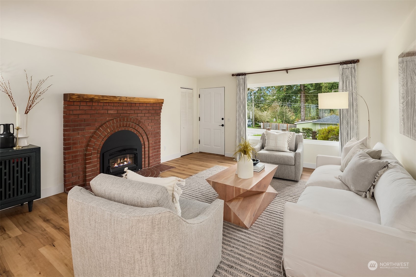 405 240th Street Southwest Bothell, WA 98021 - Photo 3 of 37 a living room with furniture and a fireplace