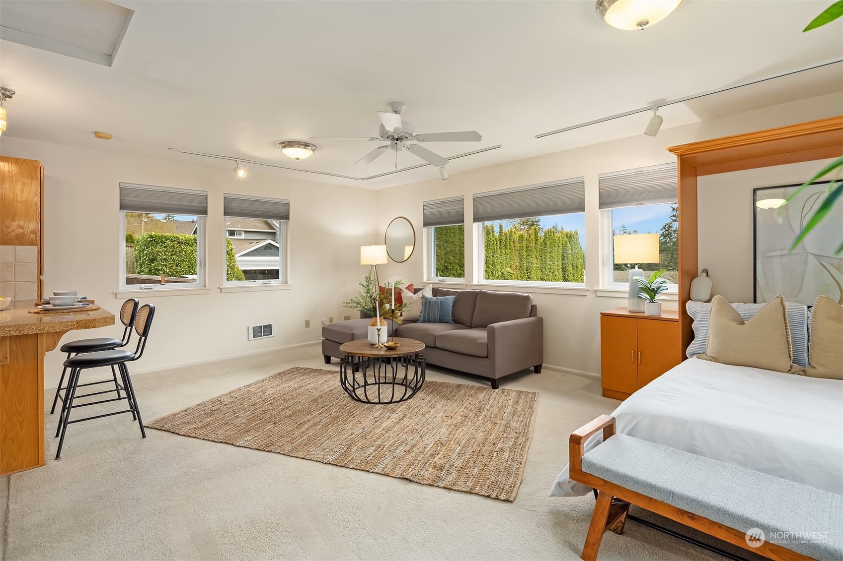 405 240th Street Southwest Bothell, WA 98021 - Photo 34 of 37 a living room with furniture a large window and a chandelier