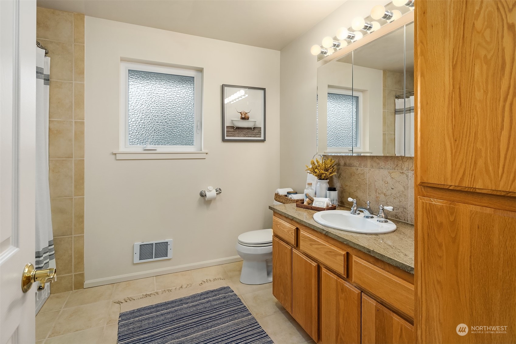 405 240th Street Southwest Bothell, WA 98021 - Photo 35 of 37 a bathroom with a granite countertop sink toilet and mirror