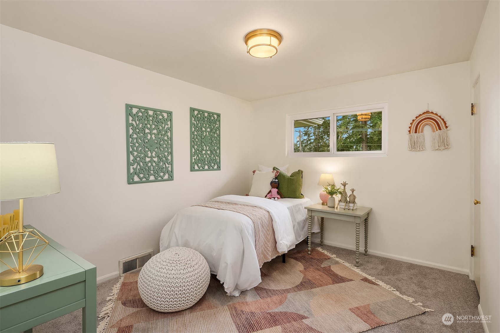 405 240th Street Southwest Bothell, WA 98021 - Photo 10 of 37 a bedroom with a bed and a lamp on dresser
