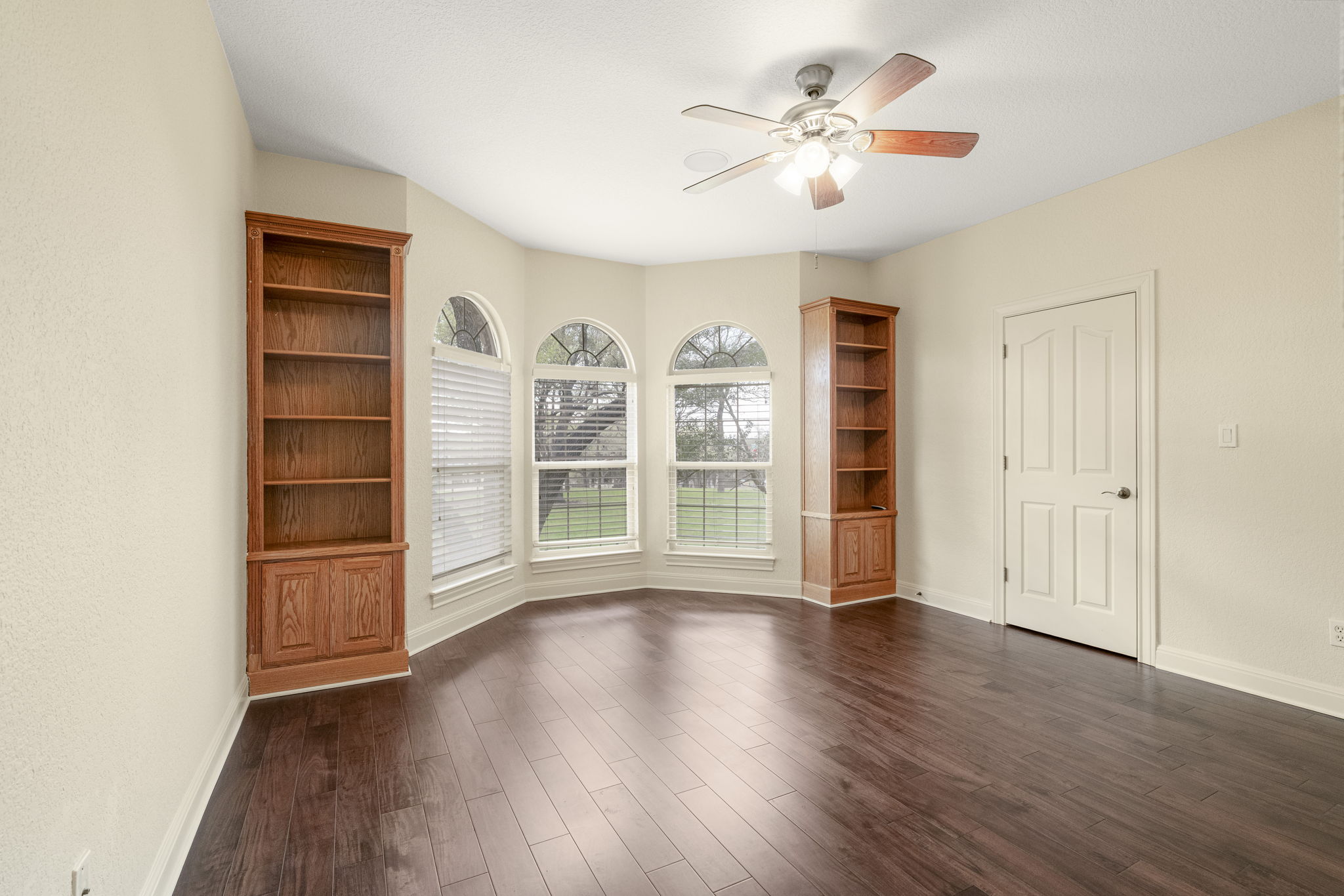 301 Goldridge Drive Georgetown, TX 78633 - Photo 27 of 40 a view of an empty room with a window and wooden floor