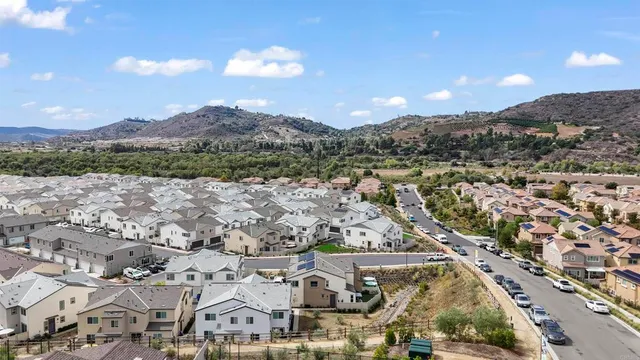 an aerial view of residential houses with outdoor space