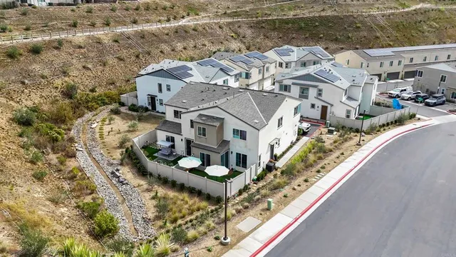 an aerial view of a house with a ocean view