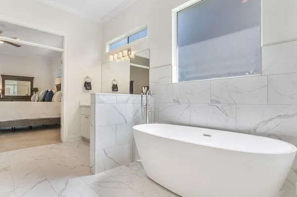 a bathroom with a bathtub and a sink
