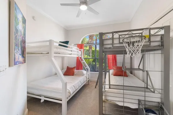 a bedroom with bunk bed and a chandelier