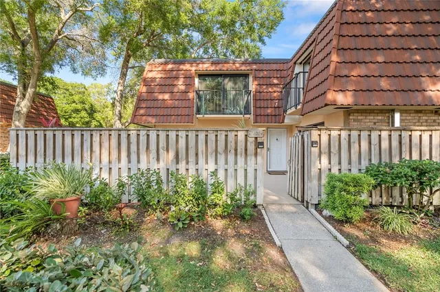 a view of a pathway with a garden