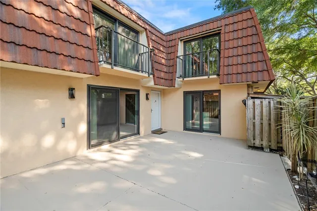 a view of a building with a window and brick walls
