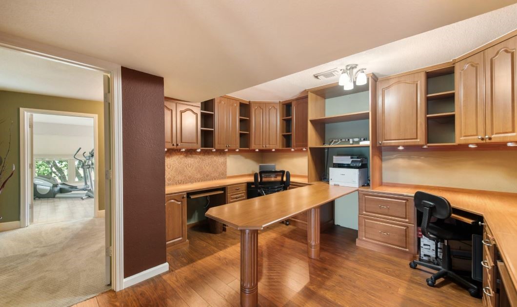 6714 Spray Lane, Unit C699A Rosharon, TX 77583 - Photo 20 of 48 Designated Home Office just steps from the Owner's Primary Suite. Tons of Built-Ins, Counter Space & Desk to spread out and get work done.