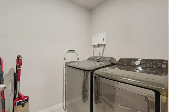 a utility room with dryer and washer