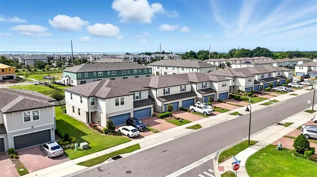an aerial view of an swimming pool with seating space