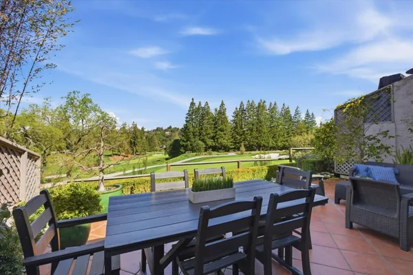 a view of a chairs and table on the terrace