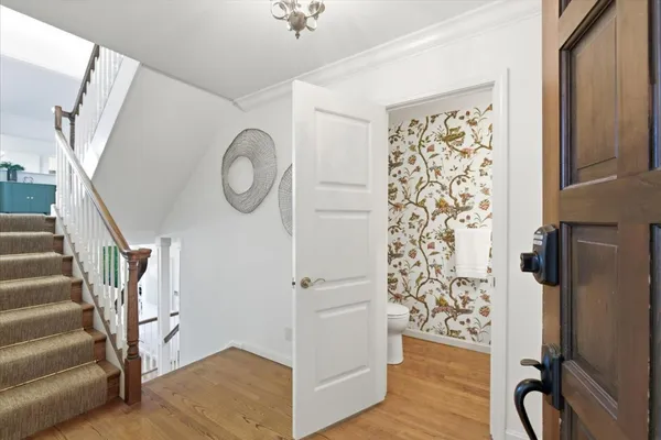 a view of entryway with wooden floor and door