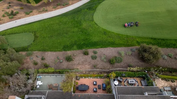 an aerial view of a house with a garden