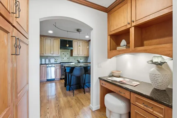a kitchen with stainless steel appliances granite countertop a stove and a refrigerator