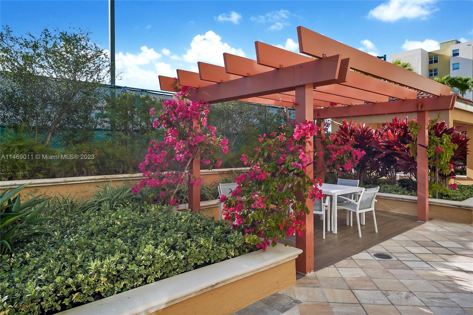 90 Alton Road, Unit 2807 Miami Beach, FL 33139 - Photo 10 of 30 a view of a chairs and table in patio