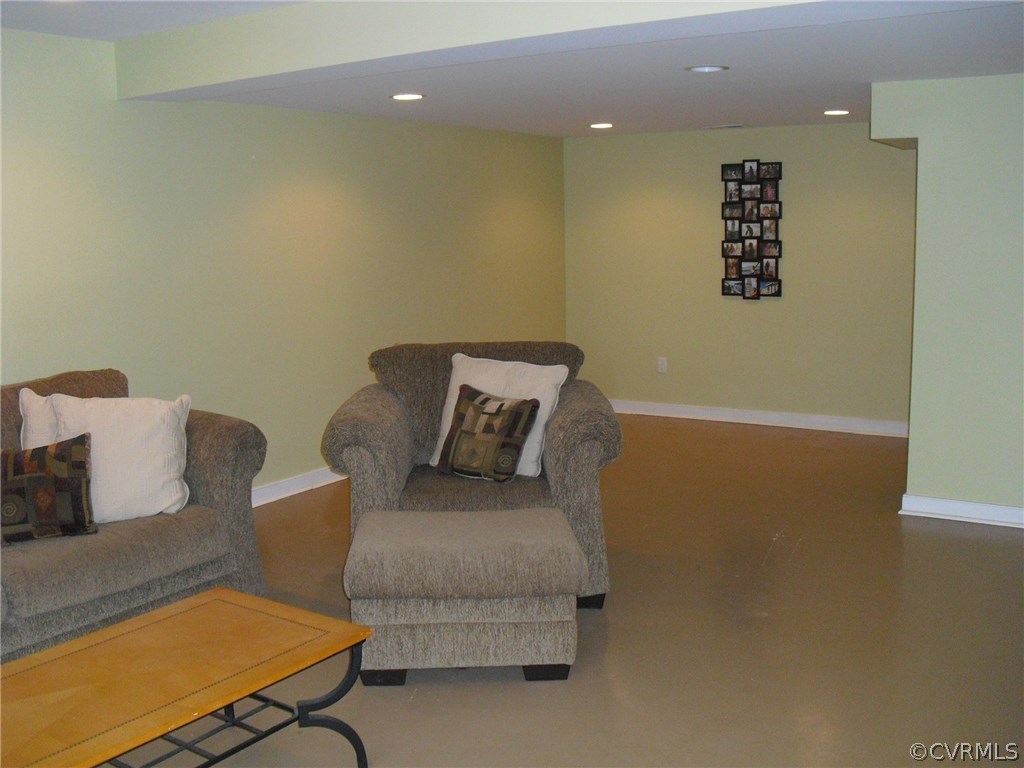 5501 Chatmoss Road Midlothian, VA 23112 - Photo 17 of 29 a couch sitting in a room next to a blue wall