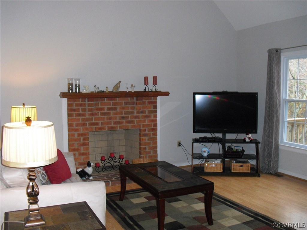 5501 Chatmoss Road Midlothian, VA 23112 - Photo 6 of 29 a living room with furniture and a flat screen tv