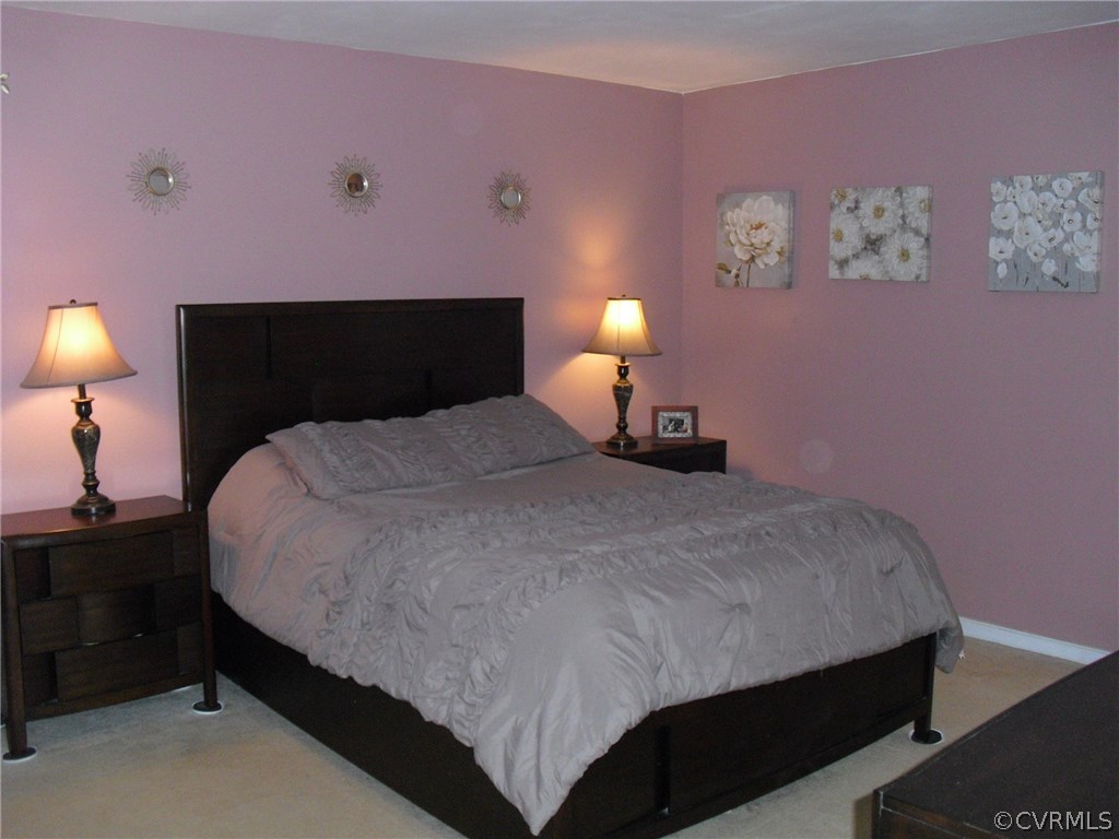 5501 Chatmoss Road Midlothian, VA 23112 - Photo 9 of 29 a bedroom with a bed and a lamp