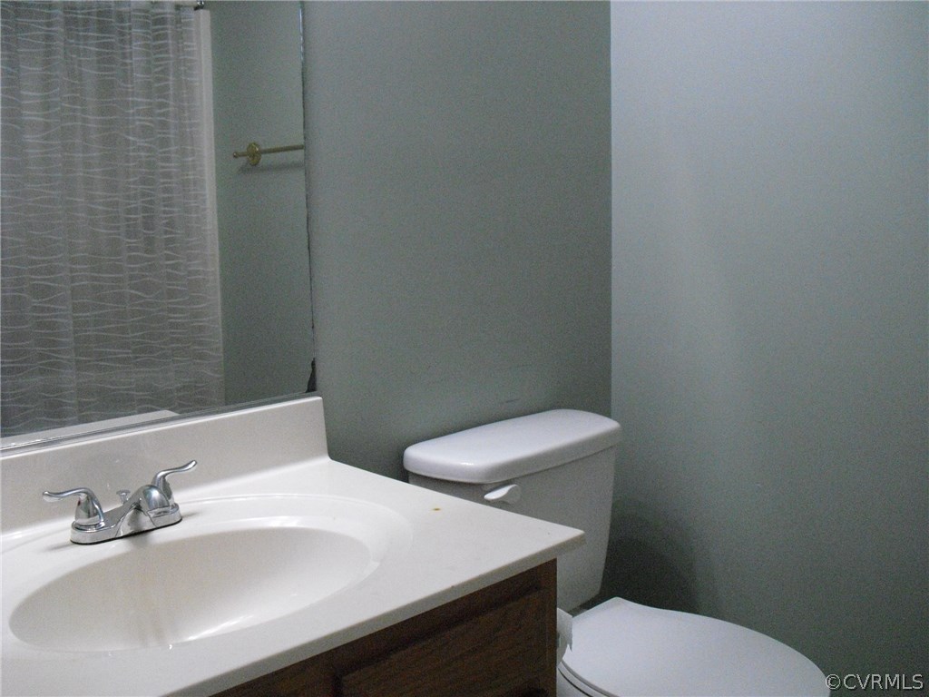 5501 Chatmoss Road Midlothian, VA 23112 - Photo 10 of 29 a bathroom with a sink a toilet and a mirror