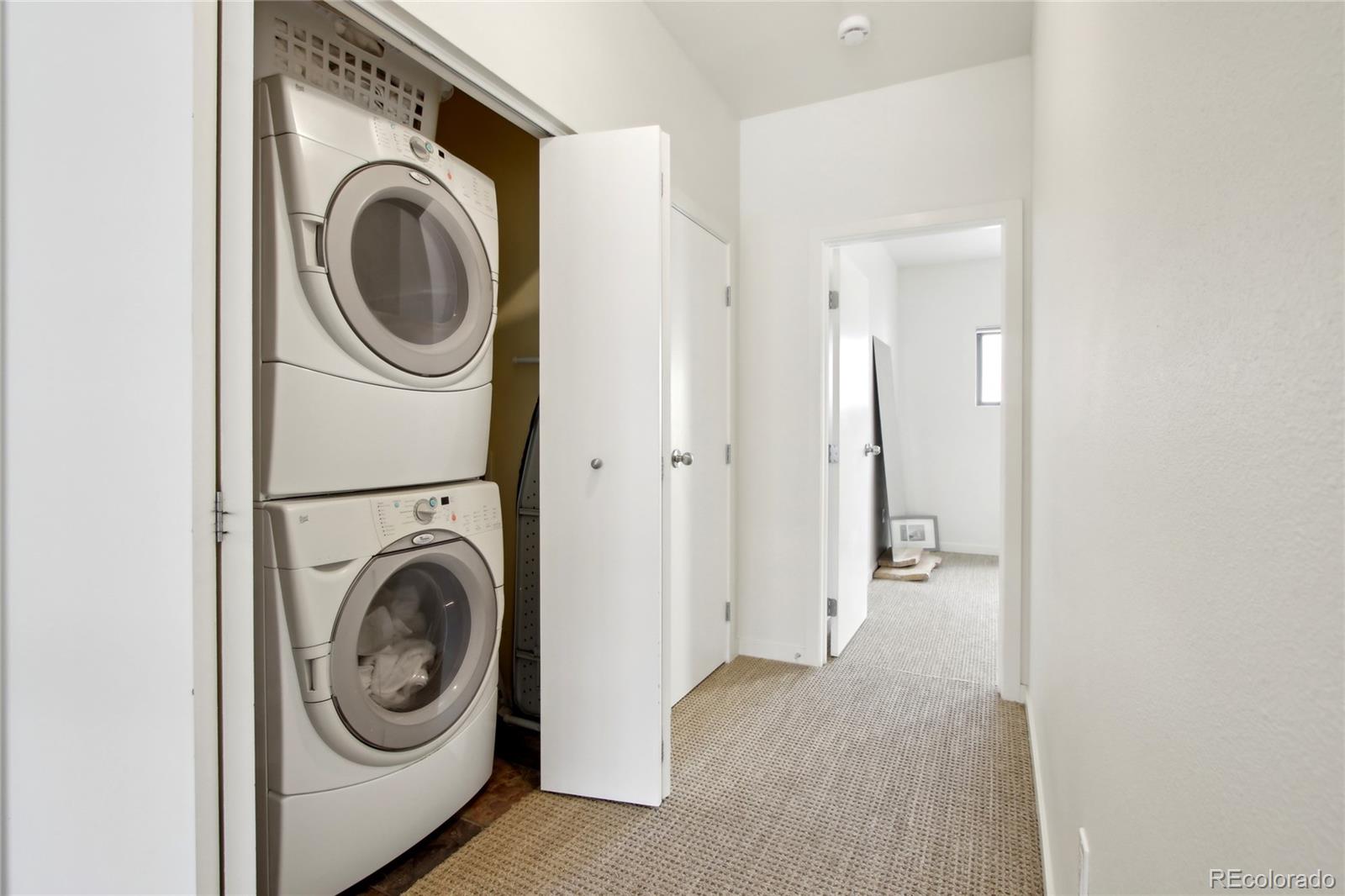 4520 Broadway, Unit 208 Boulder, CO 80304 - Photo 12 of 39 a view of a hallway with washer and dryer