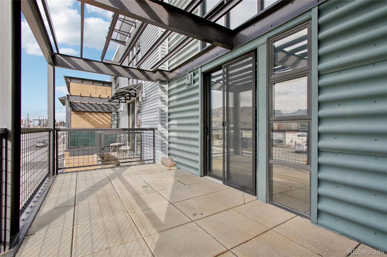 4520 Broadway, Unit 208 Boulder, CO 80304 - Photo 20 of 39 a bedroom with a bed and a large window