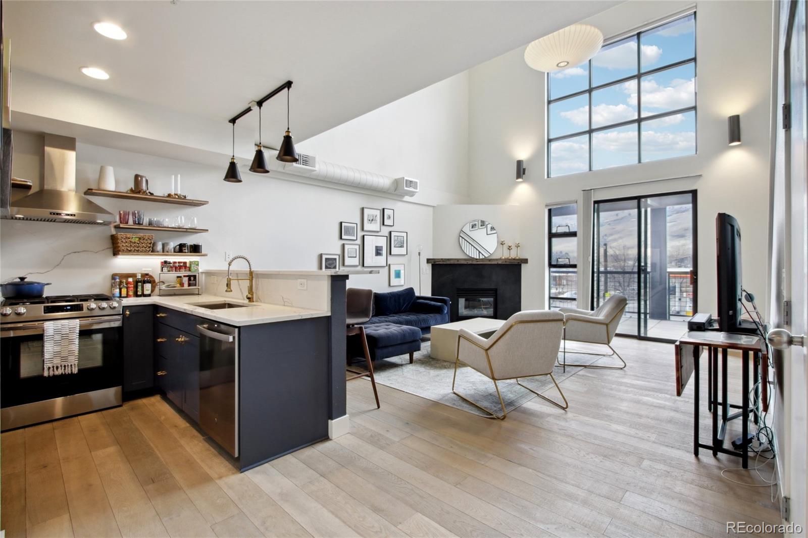 4520 Broadway, Unit 208 Boulder, CO 80304 - Photo 8 of 39 a kitchen with a table chairs refrigerator and cabinets