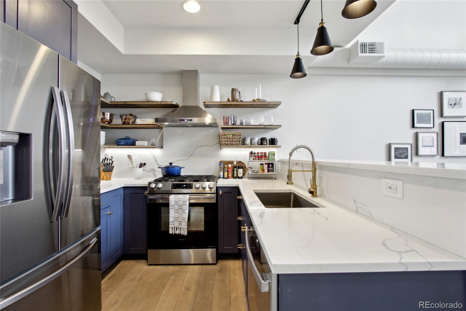 4520 Broadway, Unit 208 Boulder, CO 80304 - Photo 9 of 39 a kitchen with stainless steel appliances granite countertop a sink stove and refrigerator