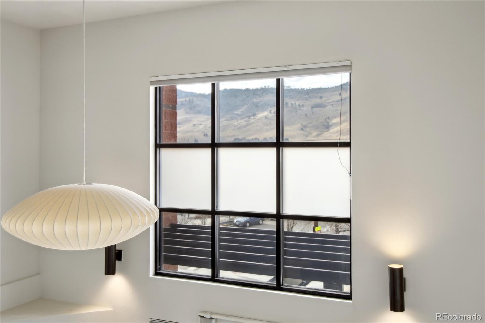 4520 Broadway, Unit 208 Boulder, CO 80304 - Photo 10 of 39 a bathroom with a window and a chandelier