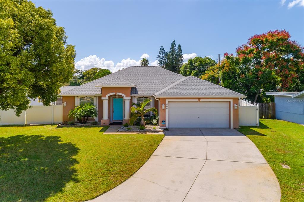 a front view of house with yard and green space