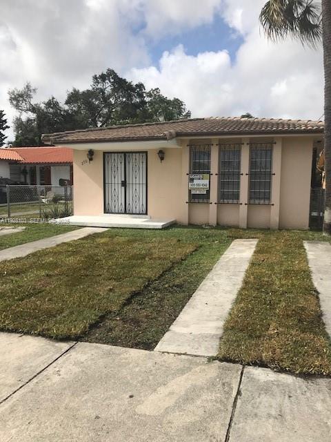 West Flagler Miami, FL 33126 - Photo 1 of 11 front view of a house with a yard